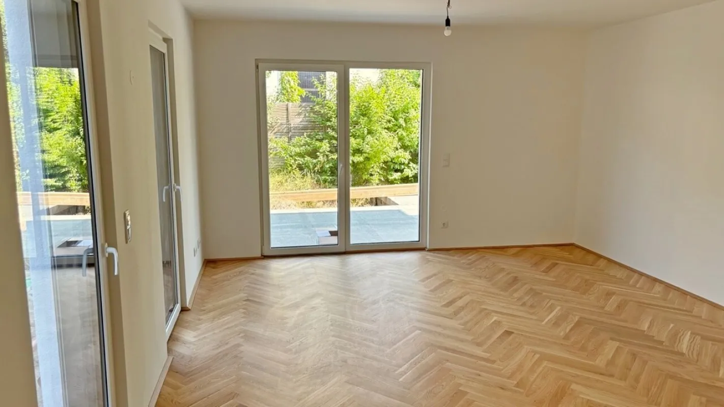 Moderne Architektur inmitten der Natur - Hochwertige 3-Zimmer Wohnung mit Garten und Terrasse! - Bild 1
