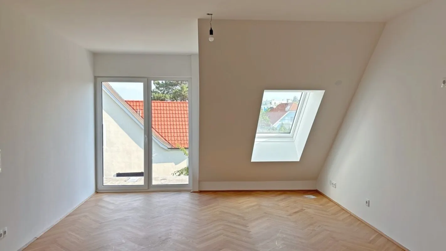 Moderne Architektur inmitten der Natur - Hochwertige Dachgeschoss 2-Zimmer Wohnung mit Balkon! - Bild 1