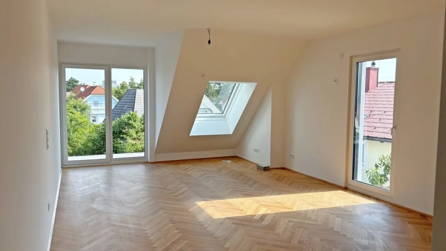 Moderne Architektur inmitten der Natur - Hochwertige Dachgeschoss 3-Zimmer Wohnung mit Balkon! - Bild 1