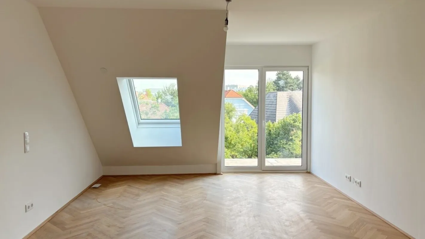 Moderne Architektur inmitten der Natur - Hochwertige Dachgeschoss 2-Zimmer Wohnung mit Balkon! - Bild 1