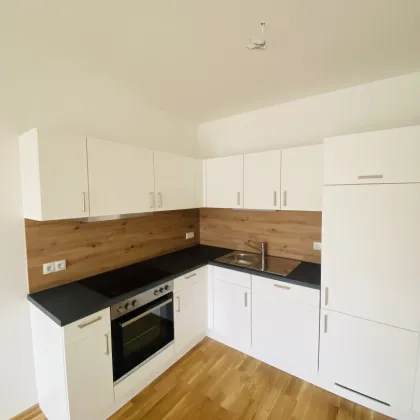 NEUBAUWOHNUNG mit herrlichem Balkon und Tiefgaragenparkplatz in ruhiger und zentraler Lage - Bild 3