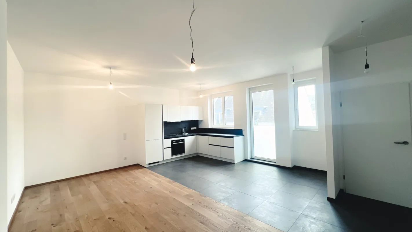 Exklusive 3-Zimmer Dachgeschosswohnung mit großzügiger Wohnküche und französischem Balkon - Bild 1
