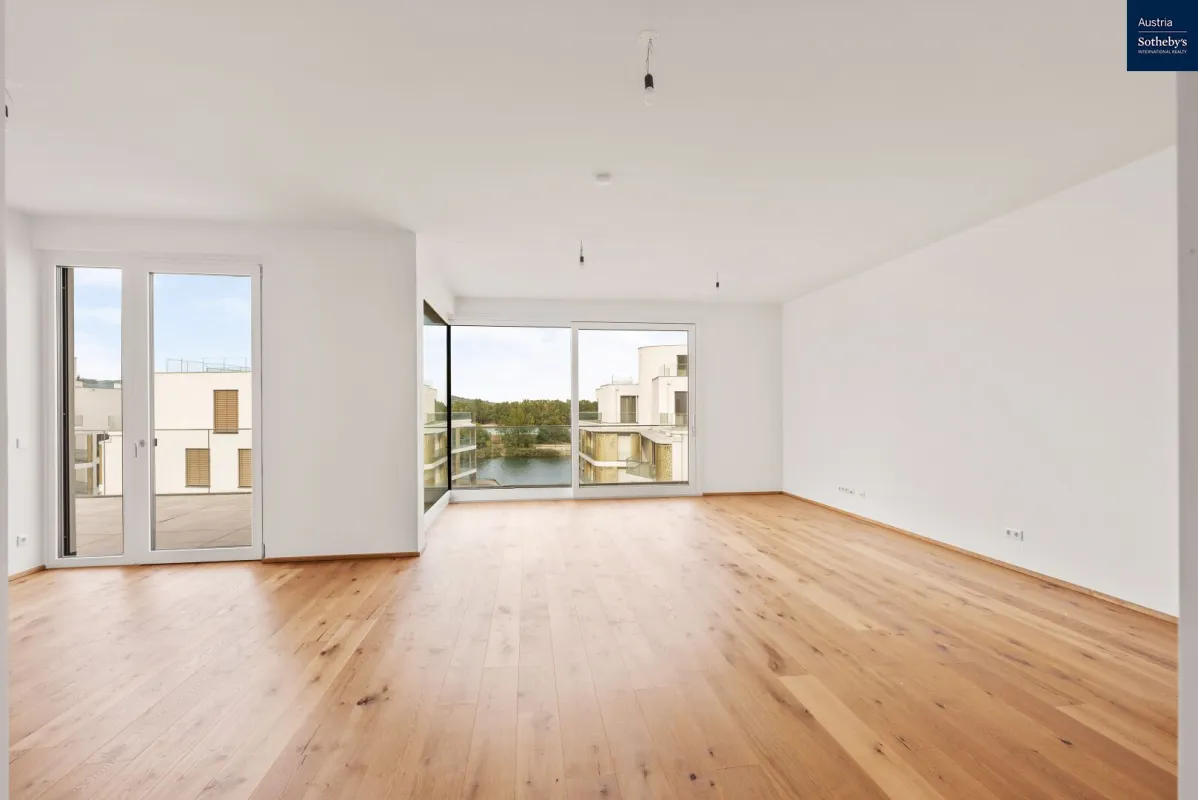 Wohn(T)raum am Wasser: Moderne Wohnung mit traumhaftem Donau-Panorama - Bild 1