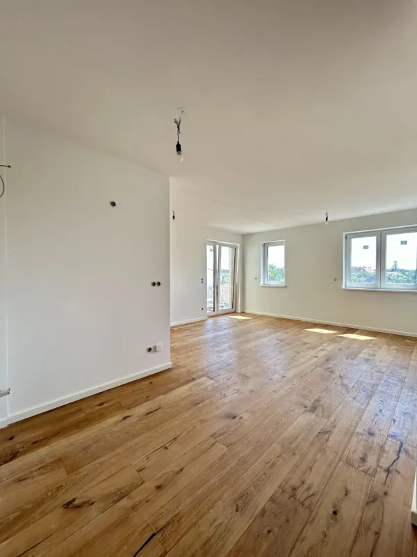 Erstklassige 73.8m² Wohnung mit Balkon in Mannswörth, Perfekt für Erstbezug! - Bild 1