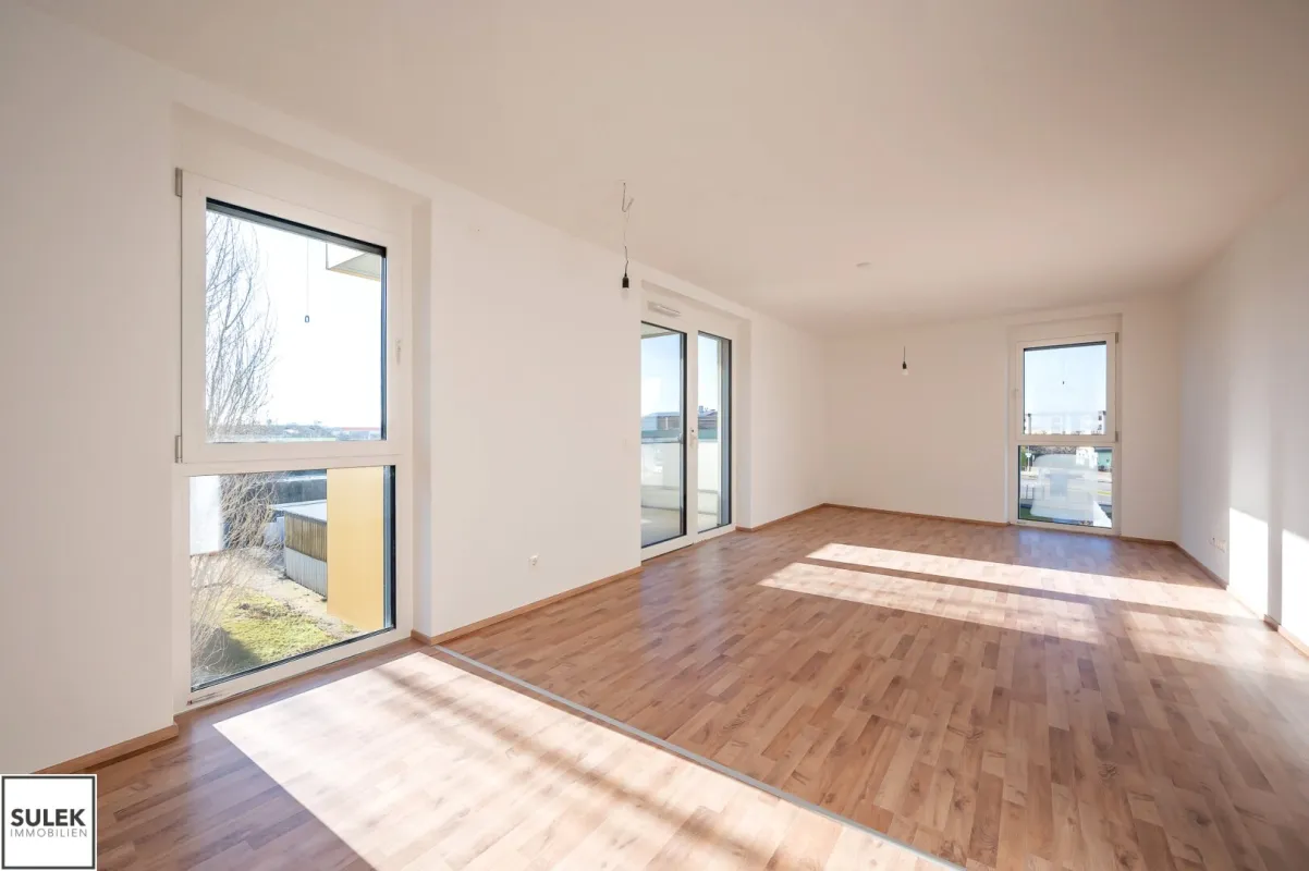 südwestlich ausgerichtete Eckwohnung mit Balkon: 3 Zimmer + 2 KFZ-Stellplätze; ERSTBEZUG in Eisenstadt! - Bild 1