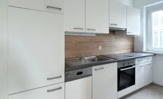 HELLE 2 ZIMMER WOHNUNG MIT KÜCHE, BALKON UND TIEFGARAGENPLATZ - 2 MONATE MIETFREI