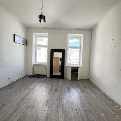 Altbauwohnung mit Entwicklungspotenzial in urbaner Ruhelage - Bild 2
