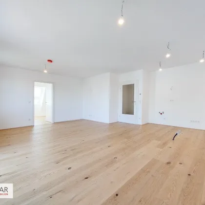Moderne Dachgeschoßwohnung in 1220 Wien – Erstbezug mit Balkon und Fußbodenheizung! - Bild 2