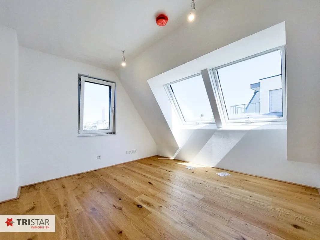 Moderne Dachgeschoßwohnung in 1220 Wien – Erstbezug mit Balkon und Fußbodenheizung! - Bild 1