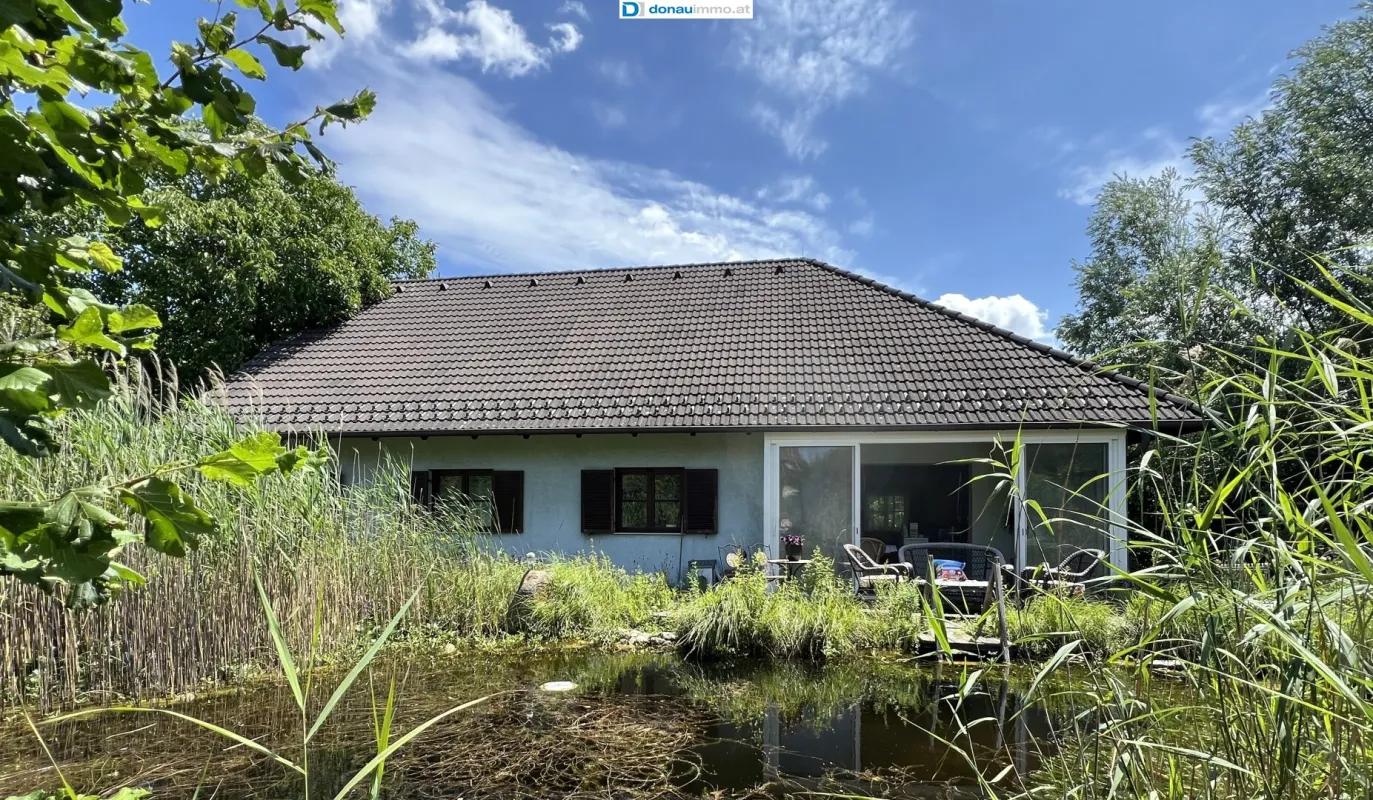 1220 Wien - Großzügiger Bungalow mit Wintergarten und zwei Wohneinheiten auf Grundstück mit 1.486 m² und 2 Wohnhäusern - Bild 1