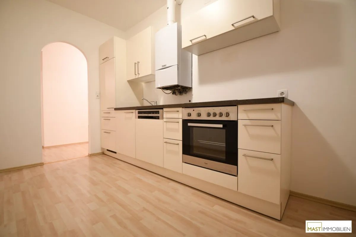 Optimal aufgeteilte 2-Zimmer Balkonwohnung in Ebergassing inkl. Neuer Küche mit Geräten und erneuerter Vaillant Therme - Bild 1