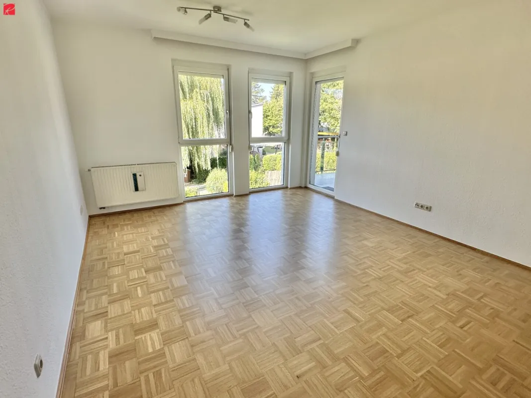Toplage genießen: Lichtdurchflutete Wohnung mit Balkon & Carport - Bild 1