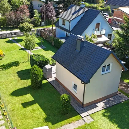 Baugrundstück in ruhiger, naturnaher Lage mit gepflegtem Holzhaus - Bild 3