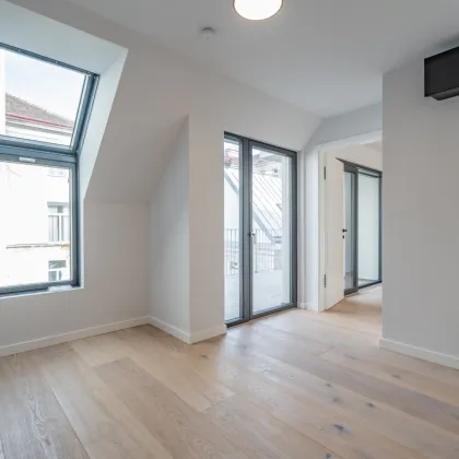 Urbaner Wohnkomfort mit Charme und Grünblick – stilvolle 3-Zimmer-Wohnung mit Balkon in ruhiger Innenhoflage - Bild 3